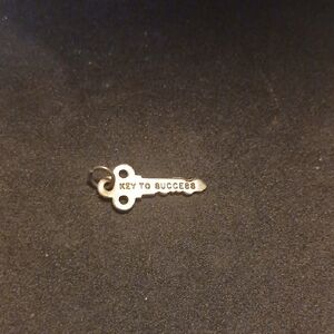 Cute Sterling Silver Charm- " Key To Success."